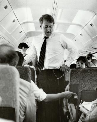 PM Brian Mulroney, shown above on his campaign plane in 1984, will spark a spending spree when he calls an election