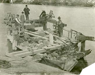 Raising the 1812 Gunboat. Photograph taken just after the sunken craft was brought to the surface of the Thames at Pikeville
