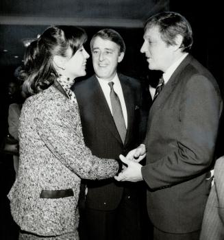 Ethnic appeal, Conservative Leader Brian Mulroney looks pleased as wife Mila is congratulated by Ontario Attorney-General Roy McMurtry after a speech (...)