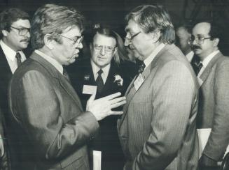 Drumming up support, Liberal leadership candidate and Indian Affairs Minister John Munro, left, chats with Liberals Jack Price, centre, and Clem Neima(...)