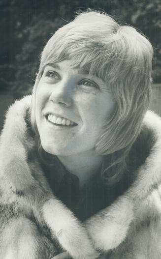 Anne Murray, human being, with one of her new life's delights, A mink coat
