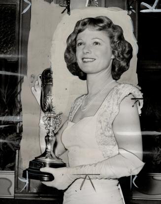 Actress Anna Neagle is pictured after being presented with the Picturegoer gold cup for the best performance of 1946
