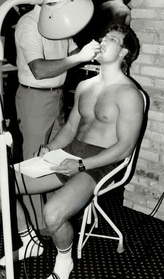 Maple Leaf defenceman Gary Nylund (top right) has his teeth examined by a dentist