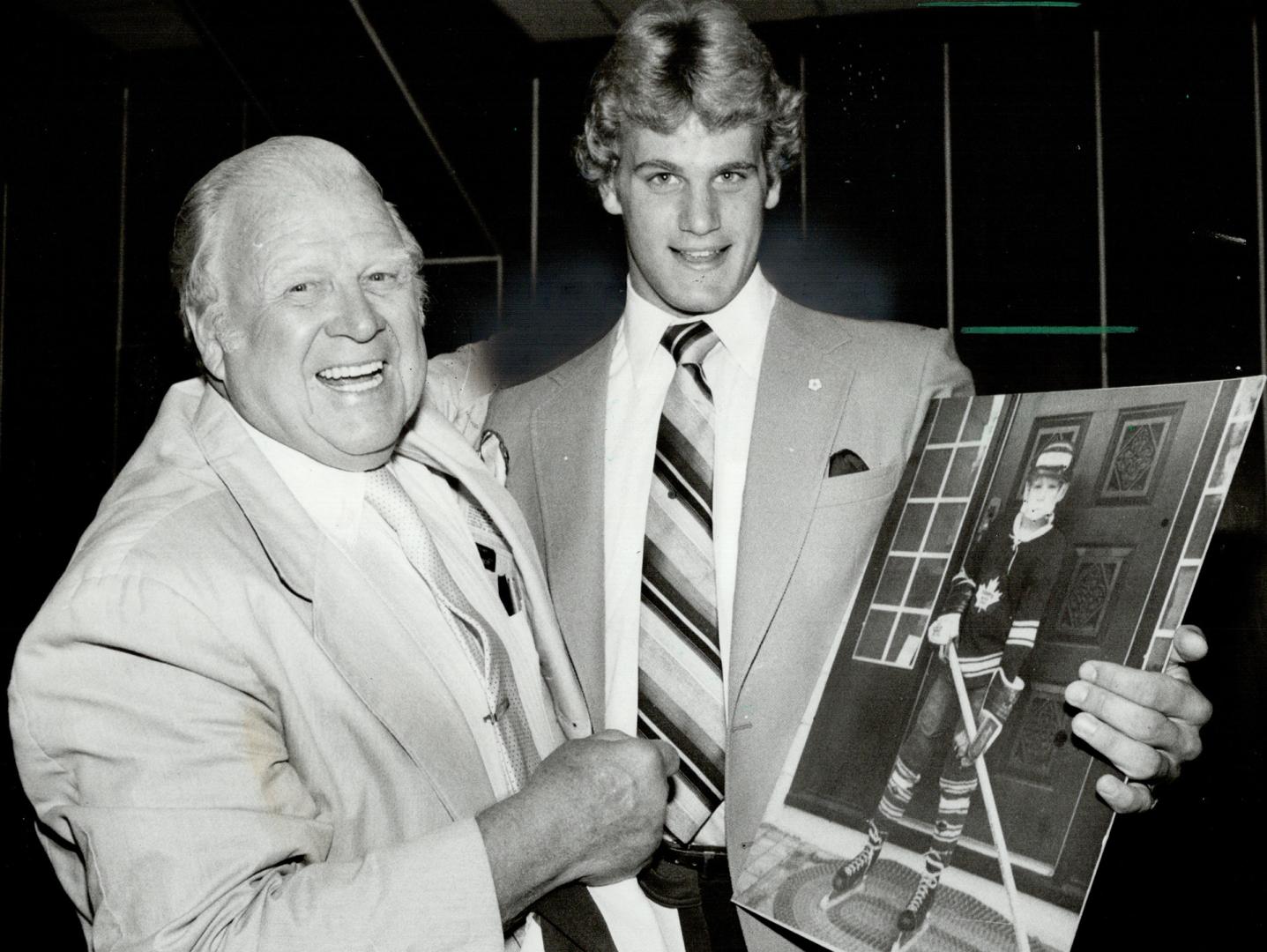 Ambition realized, Harold Ballard, owner of the Toronto Maple Leafs, welcomes defenceman Gary Nylund yesterday