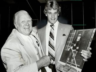Ambition realized, Harold Ballard, owner of the Toronto Maple Leafs, welcomes defenceman Gary Nylund yesterday