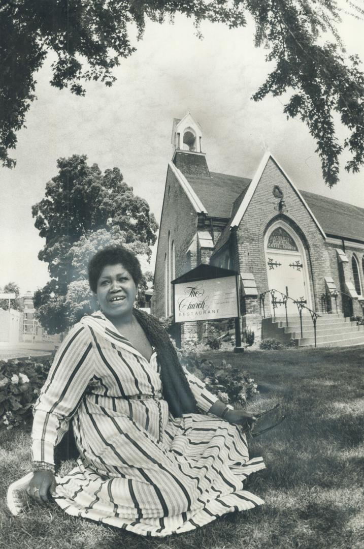 Majestic Odetta takes a break on the grass outside Stratford's newest restaurant, The Church