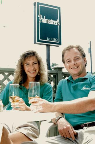 Restaurauteurs, Former Toronto Maple Leaf goalie Mike Palmeteer and his wife, Lee, relax with a drink on the patio of their new Aurora restaurant, Palmateer's