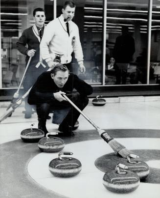 Curling Quarterback calls play, New Argo quarterback Jackie Parker was no sooner in Toronto than he headed for a curling rink