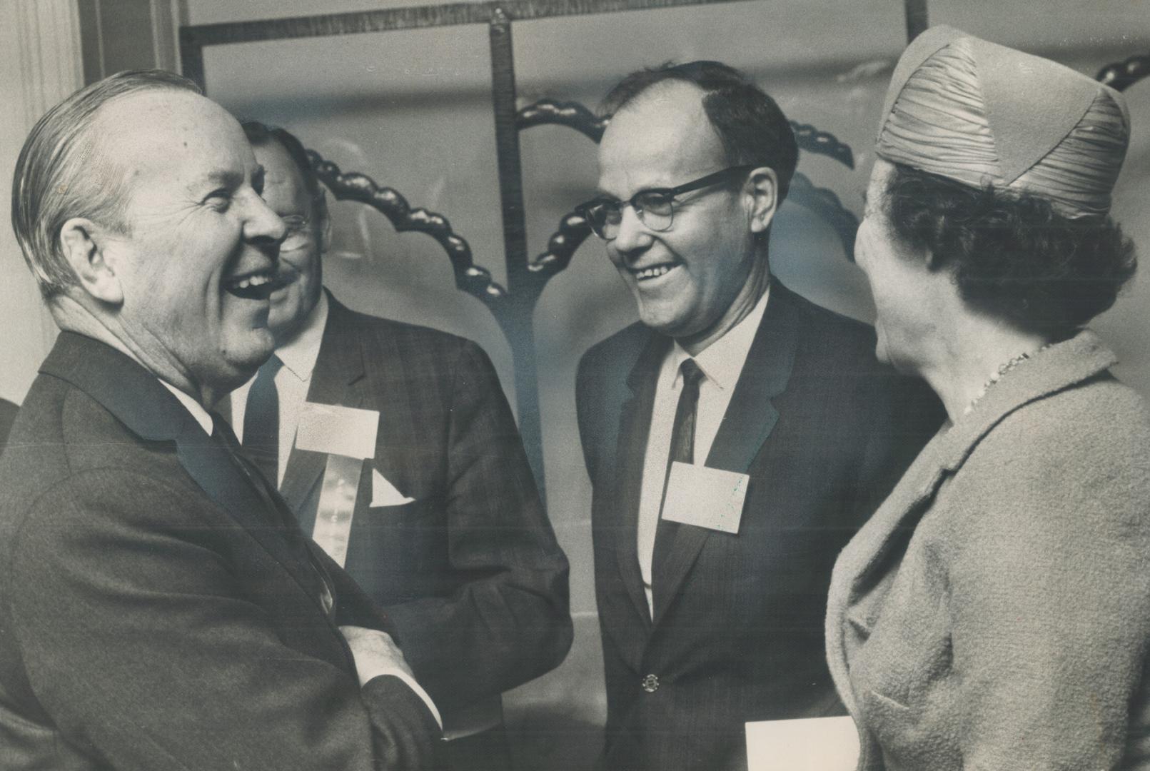 Pearson, Mrs. Jean Newman with Ontario housing authority delegates. He steered clear of political issues in the main part of his speech to them [Incomplete]