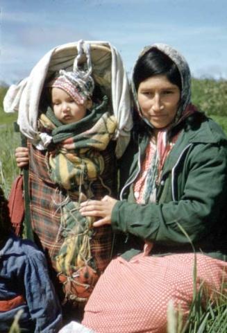 Woman with child in tiKinagun, Fort Severn