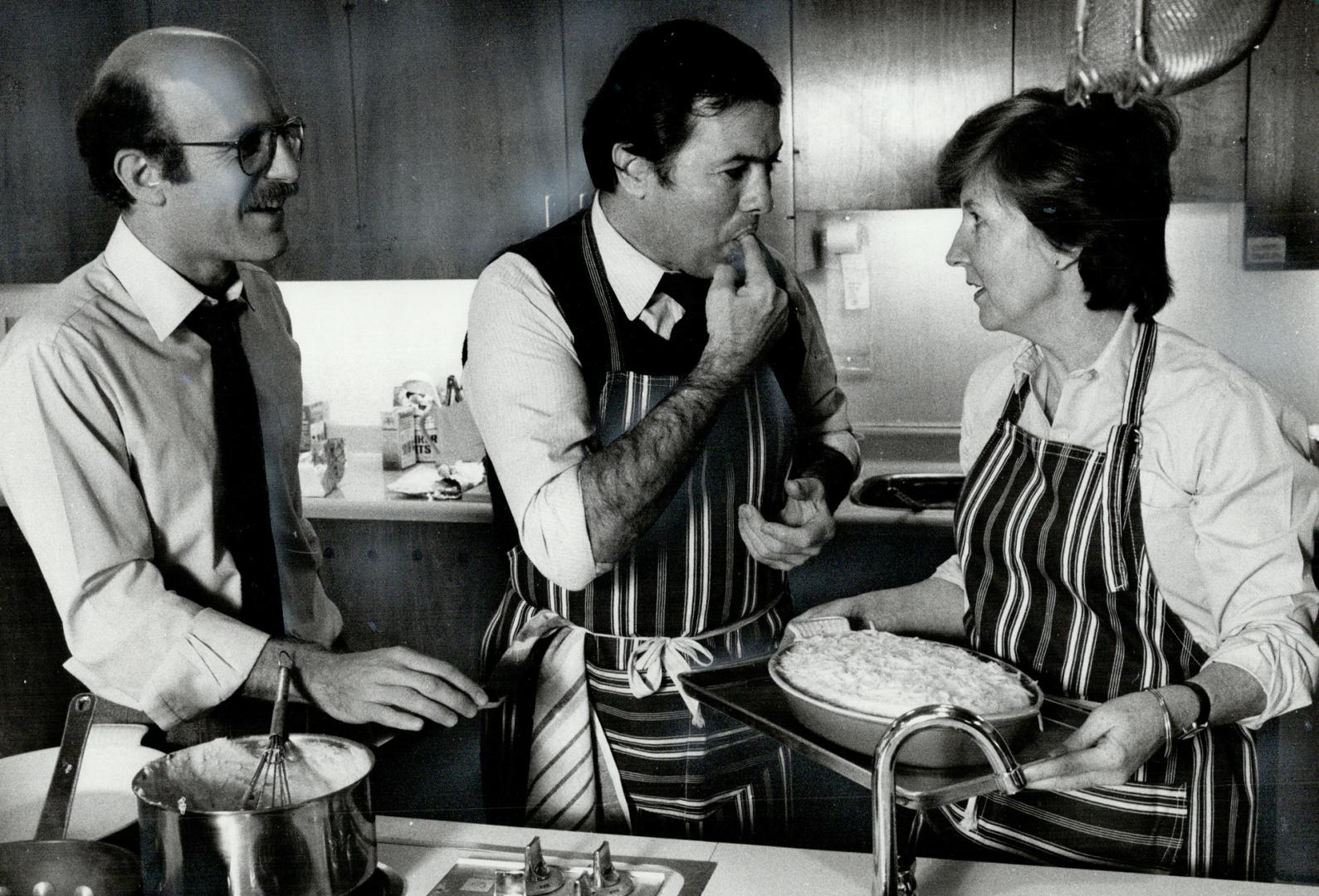 Tasting time, Chef Jacques Pepin looks pleased as he tastes a Gratin Permentier prepared by Star home economist Mary McGrath. Food writer Jim White lo(...)