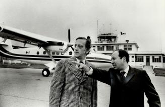 Kingston Mayor George Speal (left) is greeted at Toronto Island Airport yesterday by Alderman Paul Pickett on his arrival in a de Havilland Twin Otter(...)
