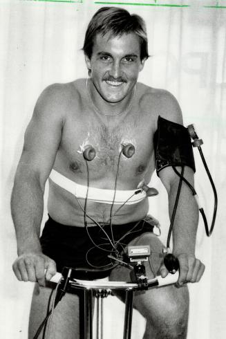 Happier days, Walt Poddubny, seen here taking a stress test while preparing for the Leafs' season at taining camp, broke his ankle yesterday and will (...)