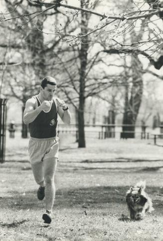 A man's best friend, Welterweight Donnie Poole, with his dog jet, jogs through a park in preparation for his upcoming bout with Louisville's Monk Fain(...)