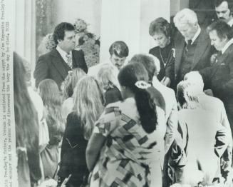 Presley's father, Vernon is assisted from the crypt by Joe Esposito