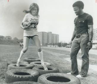 Better than the boys, Debbie Reid, 16, who came from Winnipeg to attend the Dave Raimey Football School, works out under Raimey's watchful eye at Boro(...)