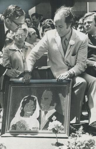 Prime Minister Pierre Trudeau admires wedding portrait of he and wife Margaret painted by Grade 8 student Mary Towler of Blessed Sacrament School in Hamilton