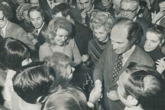 Admirers surround Prime Minister Pierre Trudeau at a reception last night at the Inn on The Park
