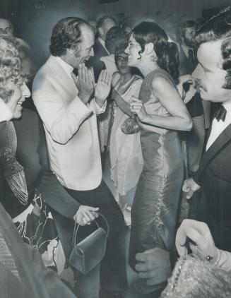 At Hamilton's 125th anniversary ball, Prime Minister Pierre Trudeau and his wife, Margaret, are cheered by some of the 900 guests. An official asked t(...)