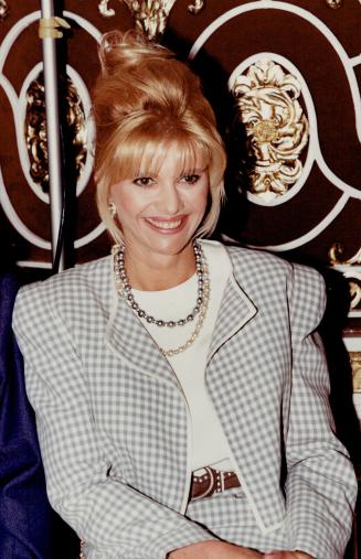 Left, Ivana Trump puts on a smile for the camera