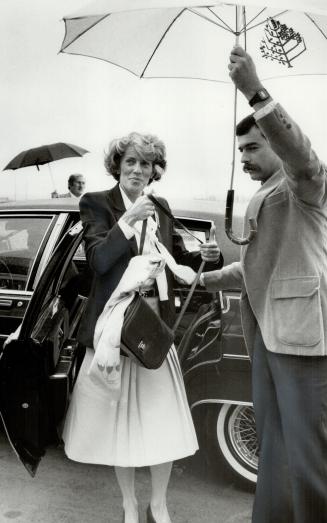 Heading home: Geills Turner, wife of Prime Minister John Turner, leaves a Vancouver Hotel yesterday for the trip home to Toronto