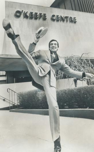The Darling of London Palladium audiences, singer and dancer Frankie Vaughan tips his straw hat and high steps outside O'Keefe Centre where he headlin(...)
