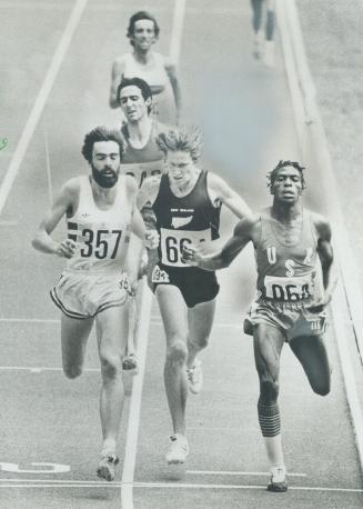 Walker boxed in: New Zealand's John Walker (centre), world record holder in the mile, gets boxed in yesterday and is eliminated in an 800-metre heat