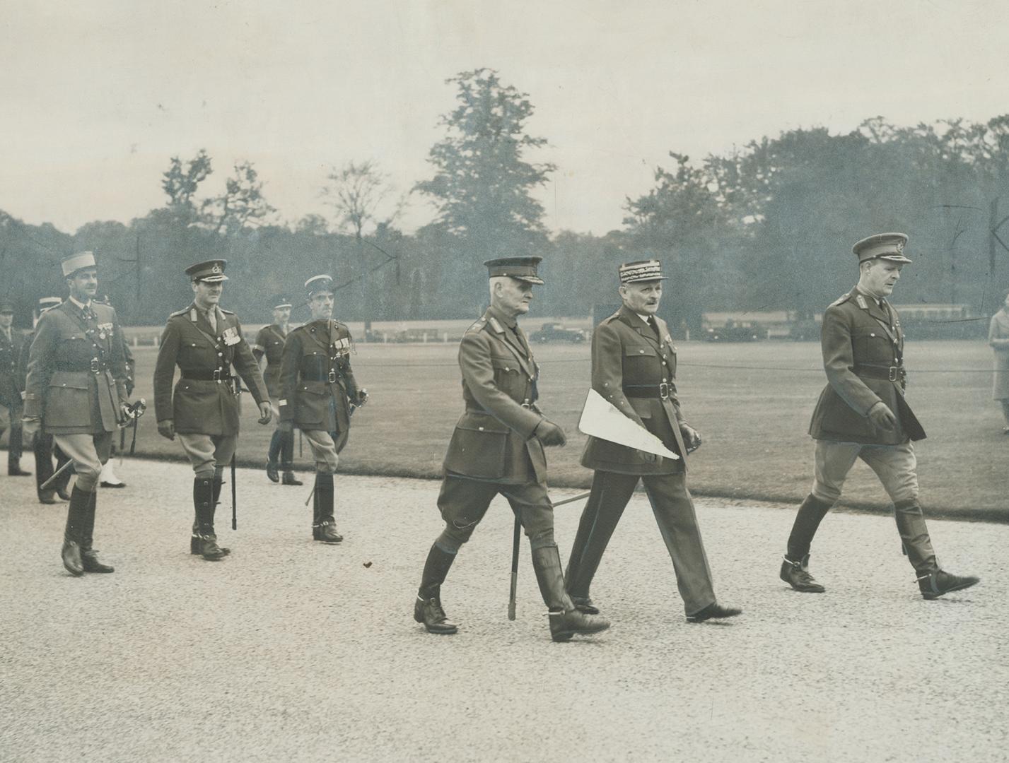 General Weygand, centre, shown as he visited the Royal Military Collee at Sandhurst, England, before the war