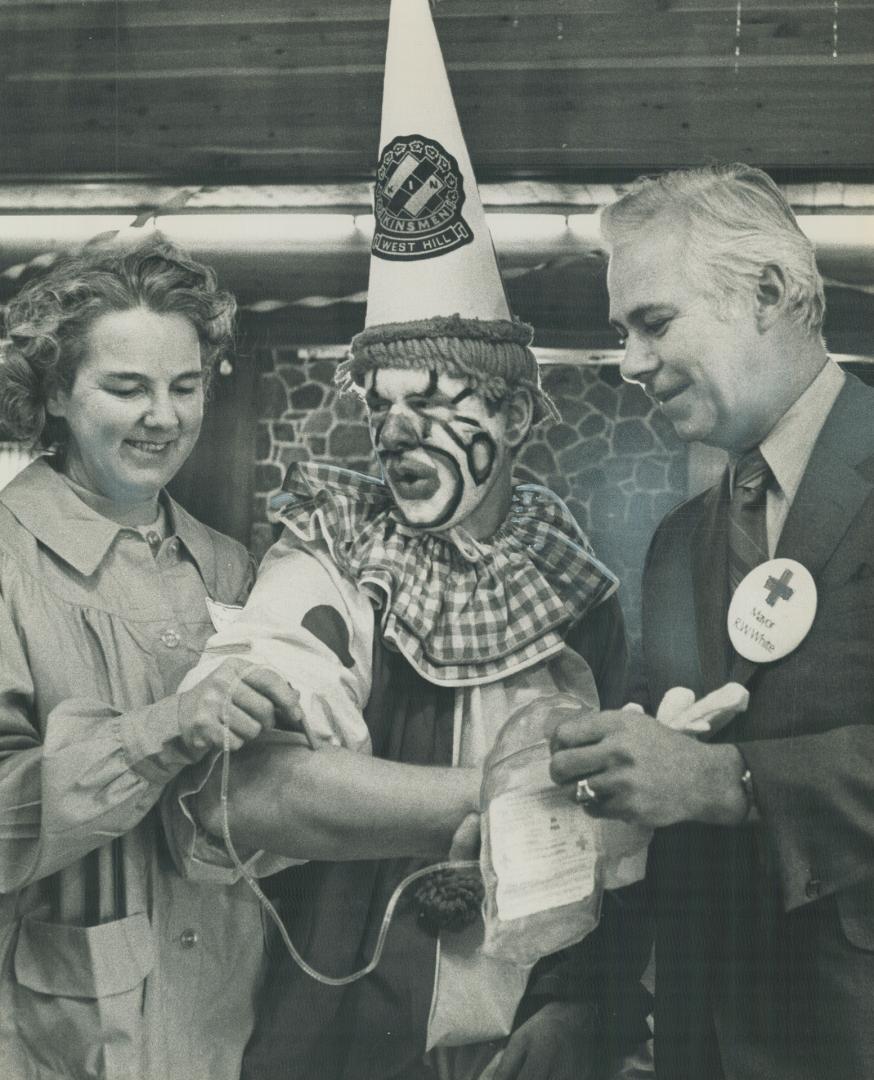 A Clown's Blood is taken by Red Cross volunteer worker Mrs