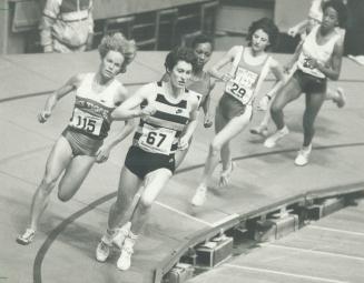 Here she comes: Lynn Williams, left, ran second to Kirsty McDermott of Britain, right, through most of last night's 1,500-metre race at the Gardens