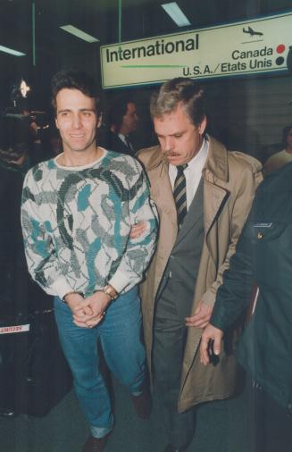 Suspects in the theft of $4.8 million in mortgage money from Canada Trust arrive in Toronto to face fraud charges. Kenneth Wood (left) and Arthur Bert(...)