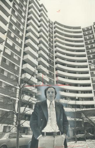 Phil Wynn in front of his West Toronto Towers property, one of 12 he owns