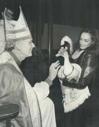 Blessing the pets: Rt. Rev. Allan Read, who's Anglican Bishop Suffragan of Toronto, reaches out a hand to bless Goomers the duck during the annual Ble(...)