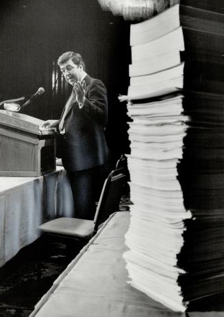 Some paperwork: Massey chairman Victor Rice looks at the stack of documents that must be signed as part of the closing of the firm's massive, $715-million refinancing deal
