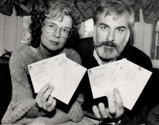 Two too many: Novelist Heather Robertson and husband Andrew Marshall, who live in Don Valley West riding, show the four federal voting cards they received