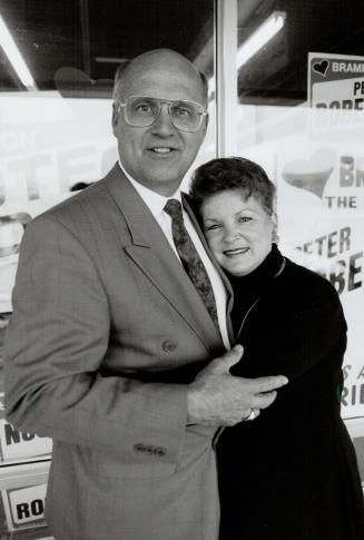 A Happy moment: Peter Robertson, and Wife, JoAnne, shared a hug at his campaign headquarters while waiting to hear of Robertson's victory at the polis on Tuesday
