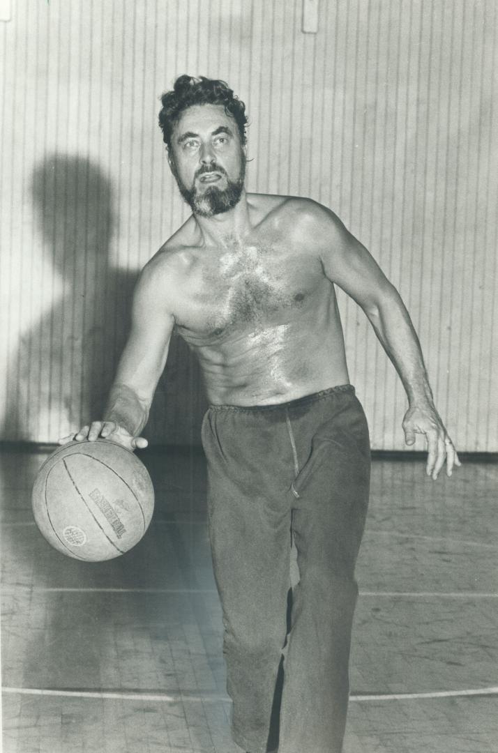 Twice weekly. Robson, right, dashes to a college gym for a noon-hour game of basketball with other professors. The game helps increase his overall body strength