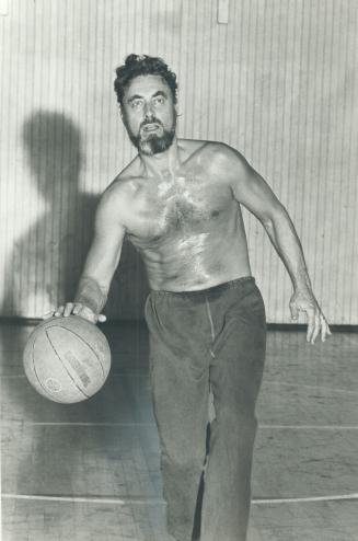 Twice weekly. Robson, right, dashes to a college gym for a noon-hour game of basketball with other professors. The game helps increase his overall body strength