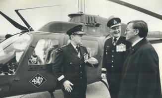 Early bird. Defence Minister Gilles Lamontagne right, chats with Maj. Gen. Richard Rohmer, chief of reserves, left, and Lt. Gen. Kenneth Lewis, comman(...)