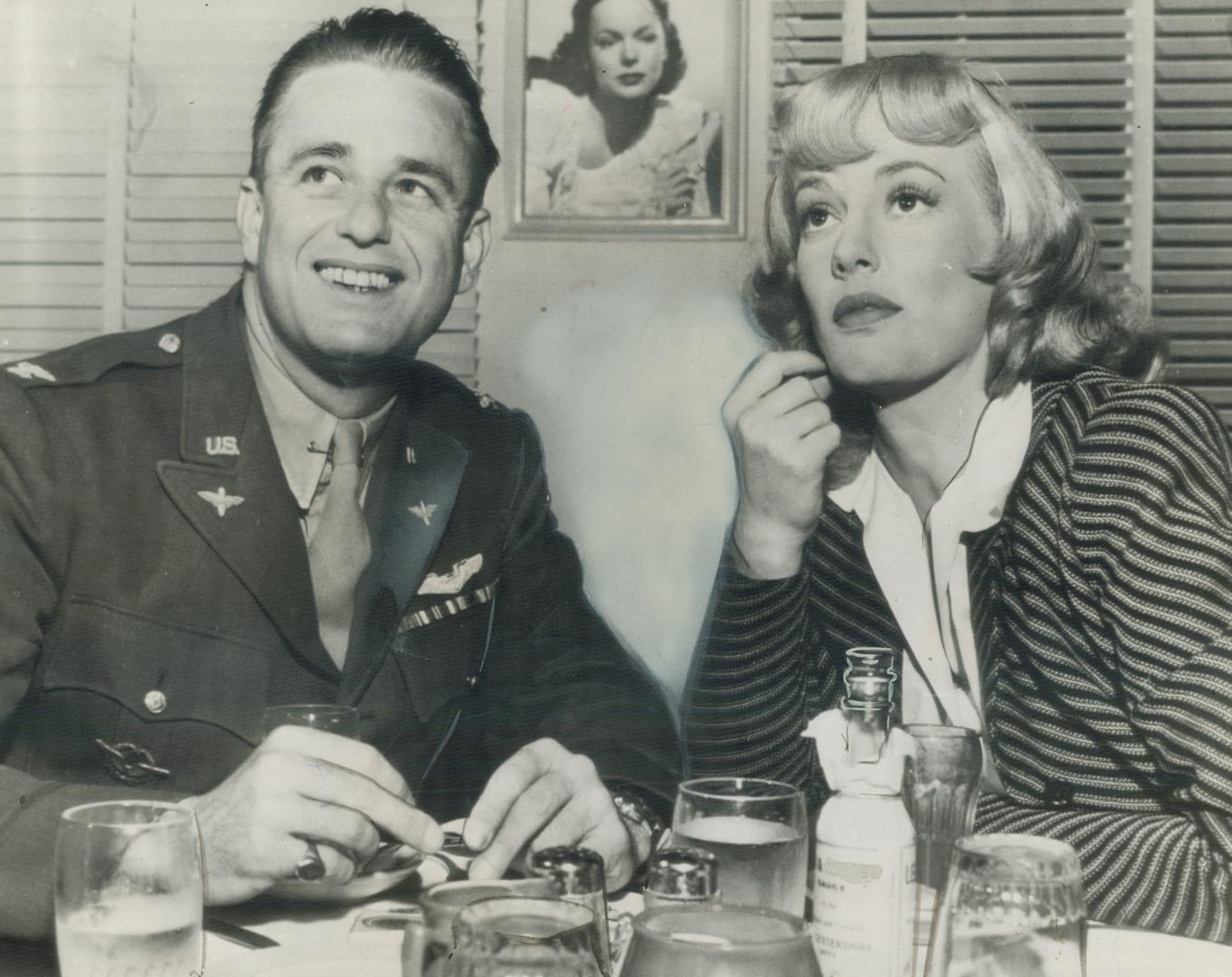 Col. Elliott Roosevelt, second son of the president of the United States, and screen actress Faye Emerson are shown at lunch together in Hollywood. Co(...)