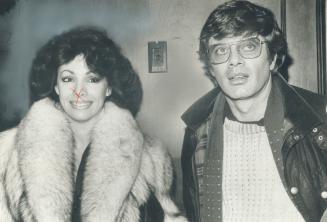 Valerie Lett, star for a day, and co-star Michael Sarrazin arrive for filming in Toronto