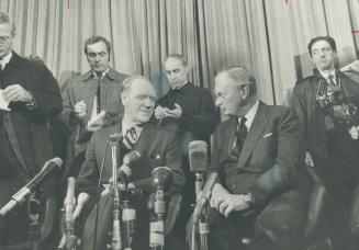 External affairs minister Mitchell Sharp (left) is shown at a press conference in London with John David British minister of industry shortly before t(...)