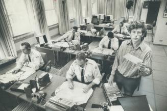 Prof. Clifford Shearing, right, has spent a total of 336 hours, spread over 42 eight-hour shifts in the master communications bureau at police headqua(...)