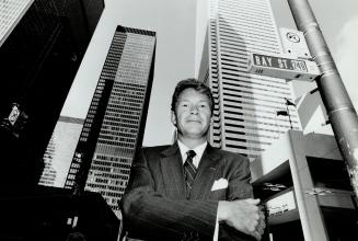 Expensive strategy: Robert Bell, executive vice-president of Dean Witter, is trying to increase market share in Toronto's retail brokerage business by attracting top producers from other firms with signing bonuses of $50,000 and up.