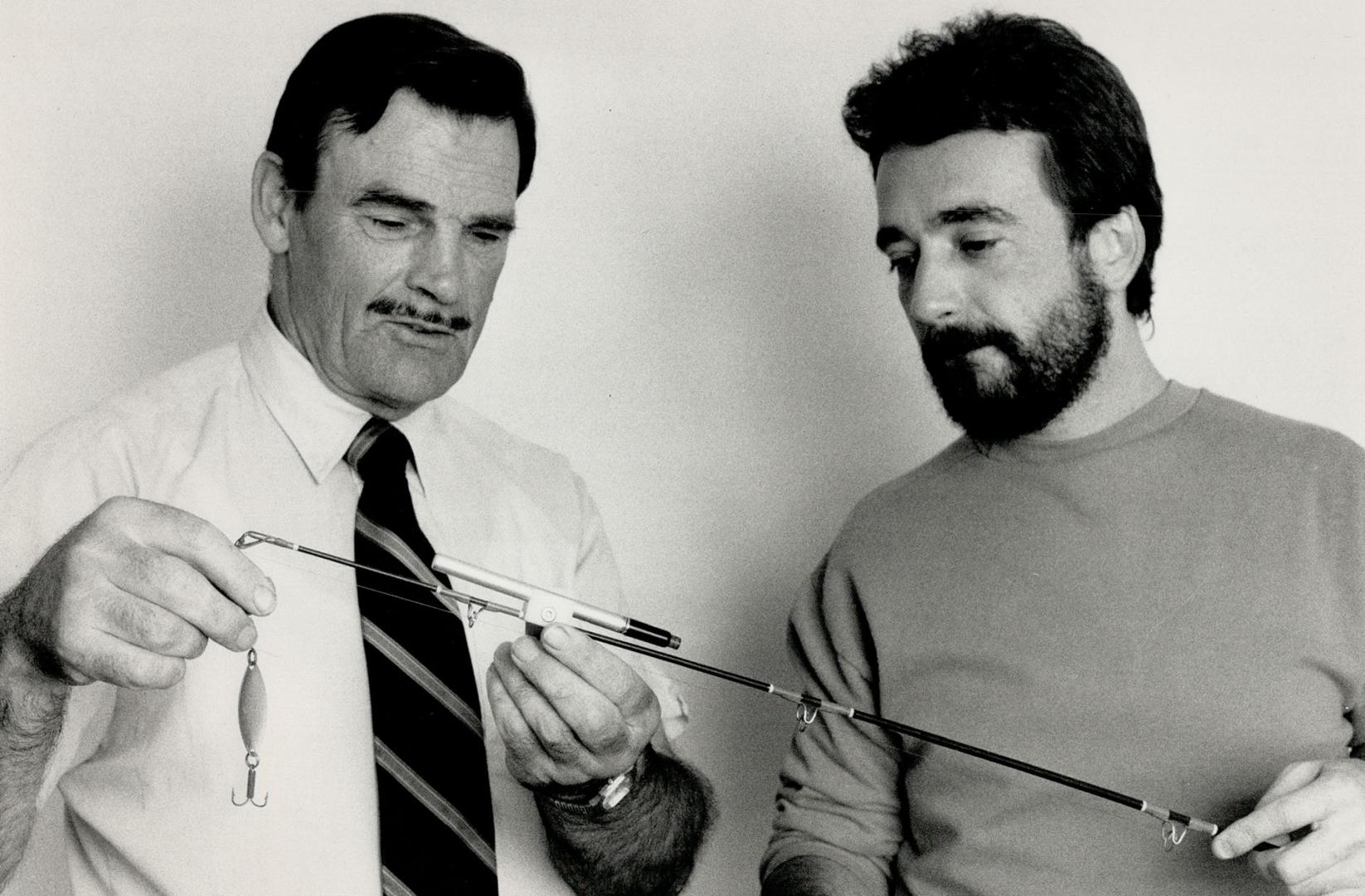 Nightfisher: Ron Blanchard Sr., left, and his son, Ron Jr., demonstrate a device they developed to make fishing at night easier.