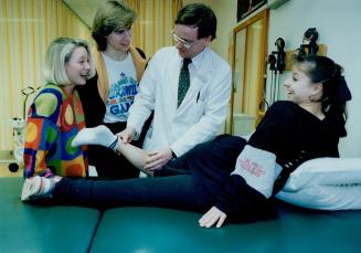Winning Team: Scarborough physician Robert Brock treats Canadian Ice dance champion Jacqueline Petr's leg at the sports medicine clinic at North York General Hospital.