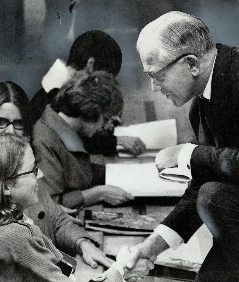 Famed British educator Sir Alexander Clegg talks with some of the 400 principals and teachers who listened to his address yesterday at Glenforest Secondar School in Mississauga. He was knighted in 1965 for outstanding contributions to British education. Yesterday, he toured a number of Peel county schools.