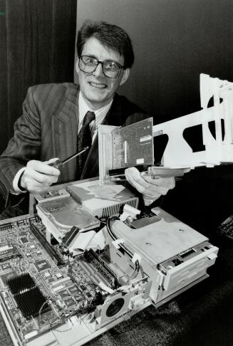 Handyman: Top man Harvey Coleman shows how to open up Dell's new, easy-access computers.