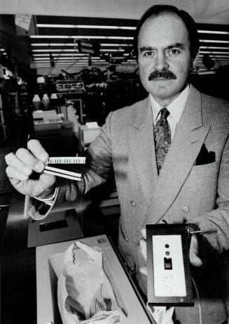 Theft proof: Paul Cadleux holds magnetized strips used to hide in or attach to a product. A strip sets off an alarm at the door, if not demagnetized by a cashier.