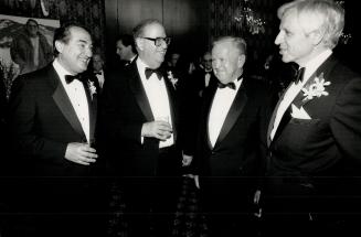 $125-a-plate dinner honors Toronto man. The Ben-Gurion University of the Negev tribute dinner for Toronto resident Ron Oelbaum, held at the Inn on the Park last night, boasted a distinguished guest list. Seen chatting are, from left: Sidney Chelsky, Canadian associate of the university, Abba Eban, Israel's former minister of foreign affairs, Morris Kaufman, committee chairman, and Martin Offman, chairman of the dinner.